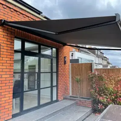 Black awning covering a patio