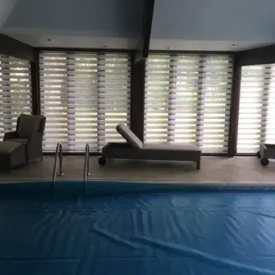 Day & night blinds for an indoor pool