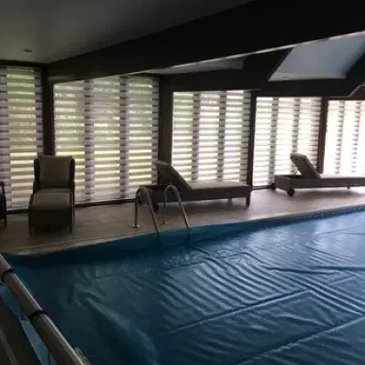 Day & night blinds for an indoor pool