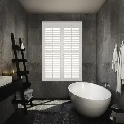 White shutters on a window in a modern bathroom