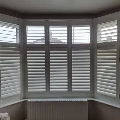 White shutters on a bay window