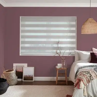 Grey and transparent striped vision blinds in a bedroom