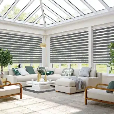 Grey and transparent striped vision blinds in a conservatory.
