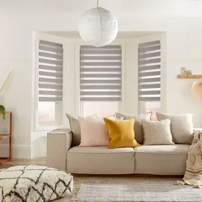 Grey and transparent striped vision blinds in a livingroom